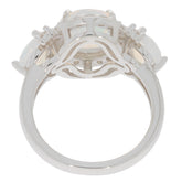 Elegant white opal sterling silver ring with accent stones, showcasing its unique design and craftsmanship from behind.